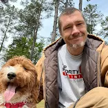 Dog Training in Jackson, SC | Top Priority K9 Training 9 Teddy the Goldendoodle with trainer Ryan in a Google review photo